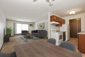 New Brighton apartment for rent - Sage Park Apartments in New Brighton, MN | living room and kitchen area