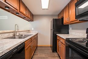 Omaha apartment for rent - Omaha, NE Beacon Hill Apartments. A kitchen with wood cabinets and marble countertops