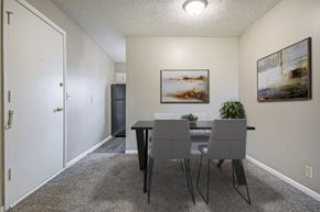 Omaha apartment for rent - Omaha, NE Maple Ridge Apartments. A dining room with a table and chairs