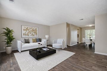 Omaha apartment for rent - a living room with a white couch and a coffee table