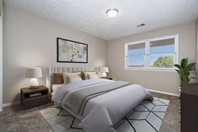Omaha apartment for rent - Omaha, NE Maple Ridge Apartments. A bedroom with a large bed and a large window