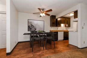 White Bear Lake apartment for rent - White Bear Lake, MN White Bear Terrace Apartments/. a dining area with a table and chairs and a kitchen in the background