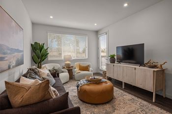 A living room with couches and a tv