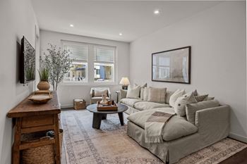 A living room with a couch and a table