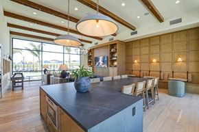 Rancho Cucamonga apartment for rent - a large kitchen with a large island and a dining table  at Westbury Apartments, Rancho Cucamonga, CA