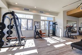 Rancho Cucamonga apartment for rent - a gym with exercise equipment and windows at the district flats apartments  at Westbury Apartments, Rancho Cucamonga, California