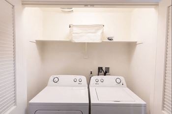 Inunit laundry room with washer and dryer