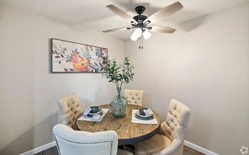 Upland apartment for rent - A dining room with a round table and chairs.