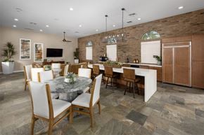 Ontario apartment for rent - A modern dining room with a large table and chairs.