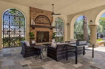 California room with built-in fireplace opening to pool area