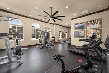 Fitness center with cardio and strength-training equipment with individual tv's