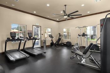 Fitness center with cardio and strength-training equipment with individual tv's