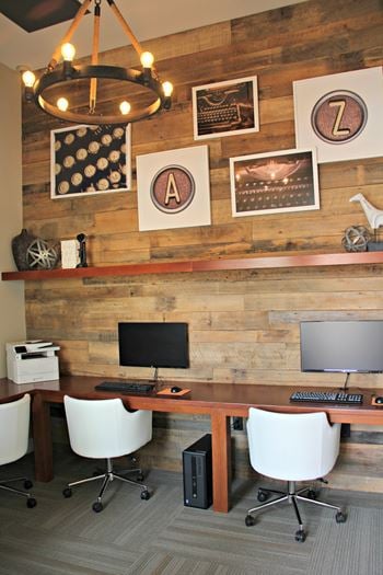 Home office workspace with wood accent wall