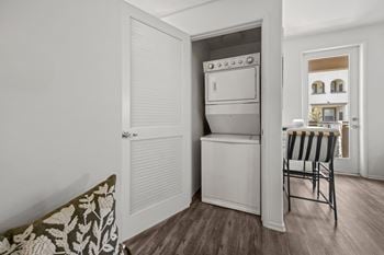 Stacked washer and dryer in closet
