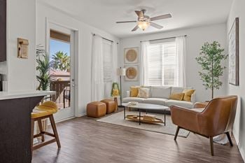 Living room with modern furniture and balcony access