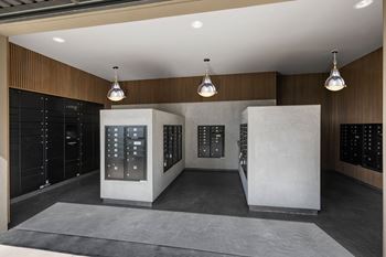 The tasting room has a large selection of wines and a large wall of wine racks