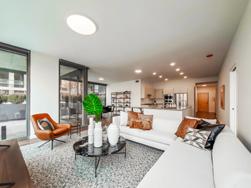 Chicago apartment for rent - a living room with a white couch and a glass table