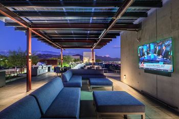 Outdoor entertainment area with tvs