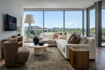 Floor-to-ceiling windows with high-performance glazing and acoustical glass for sound reduction