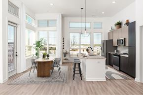 Atlanta apartment for rent - A modern kitchen with a dining table and chairs.