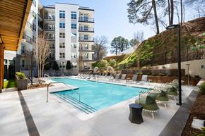 Atlanta apartment for rent - Outdoor pool with chairs and a view of the building