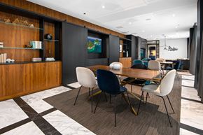 Chicago apartment for rent - A modern dining room with a wooden table and chairs.