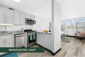 Chicago apartment for rent - A renovated kitchen with a stove top oven and microwave.