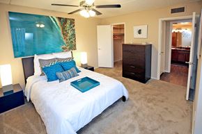 Phoenix apartment for rent - a bedroom with a bed and a ceiling fan