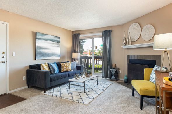 Aurora apartment for rent - a living room with a couch and a fireplace