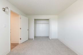 Aurora apartment for rent - an empty bedroom with a closet and a door to a wardrobe