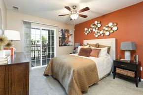 Denver apartment for rent - a bedroom with a bed and a ceiling fan