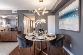 Aurora apartment for rent - A dining room with a round table set for four.