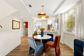 Wilton Manors townhouse for rent - A dining room with a table and chairs.