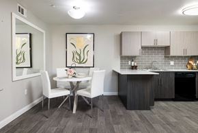 Las Vegas apartment for rent - a dining room with a table and chairs next to a kitchen
