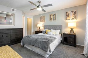 Las Vegas apartment for rent - the preserve at ballantyne commons bedroom with bed and ceiling fan