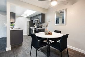 Henderson townhouse for rent - an open kitchen and dining area with a table and chairs