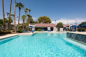 Henderson townhouse for rent - a large swimming pool with a building in the background