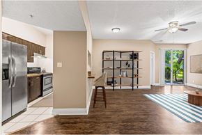 Hollywood apartment for rent - A kitchen with a refrigerator, oven, and microwave.