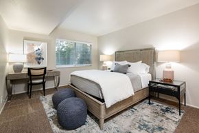 Salt Lake City apartment for rent - a bedroom with a bed and a round window