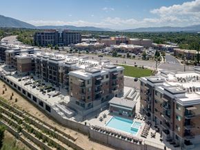 Midvale apartment for rent - an aerial view of a city with buildings and a pool