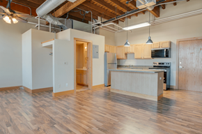 Moorhead apartment for rent - A kitchen area with wooden floors and a counter, Kassenborg Apartments, Moorhead, MN, 56560