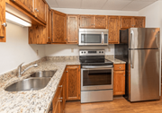 Fargo apartment for rent - A kitchen with a stove, oven, sink, and refrigerator at Block 6 Apartments, North Dakota, 58103