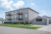 Moorhead apartment for rent - a large apartment building with balconies and a sign that reads condominium  at Courtyard Apartments, Moorhead, 56560