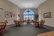 St Cloud apartment for rent - a dining room with a table and chairs and a large window at Savanna Apartments, St Cloud, MN, 56303