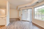 Fargo apartment for rent - A room with a sliding glass door and wooden flooring.