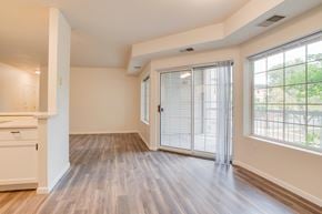Fargo apartment for rent - A room with a sliding glass door and wooden flooring.