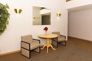 Zimmerman apartment for rent - a room with a table and three chairs in front of a mirror