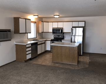 Fargo apartment for rent - A kitchen with a sink, stove, and refrigerator, Royal Oaks Apartments, ND