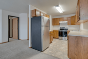 Fargo apartment for rent - A kitchen with a refrigerator, oven, and stove.