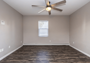 Fargo apartment for rent - A room with a ceiling fan and wooden flooring. at Warehouse Apartments, Fargo
